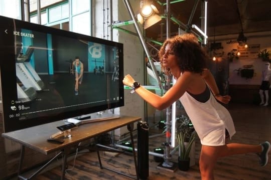 Samsung Gear Sport Being used for a fitness program on samsung TV